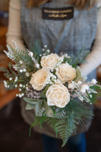 White sola flowers in an arrangement.