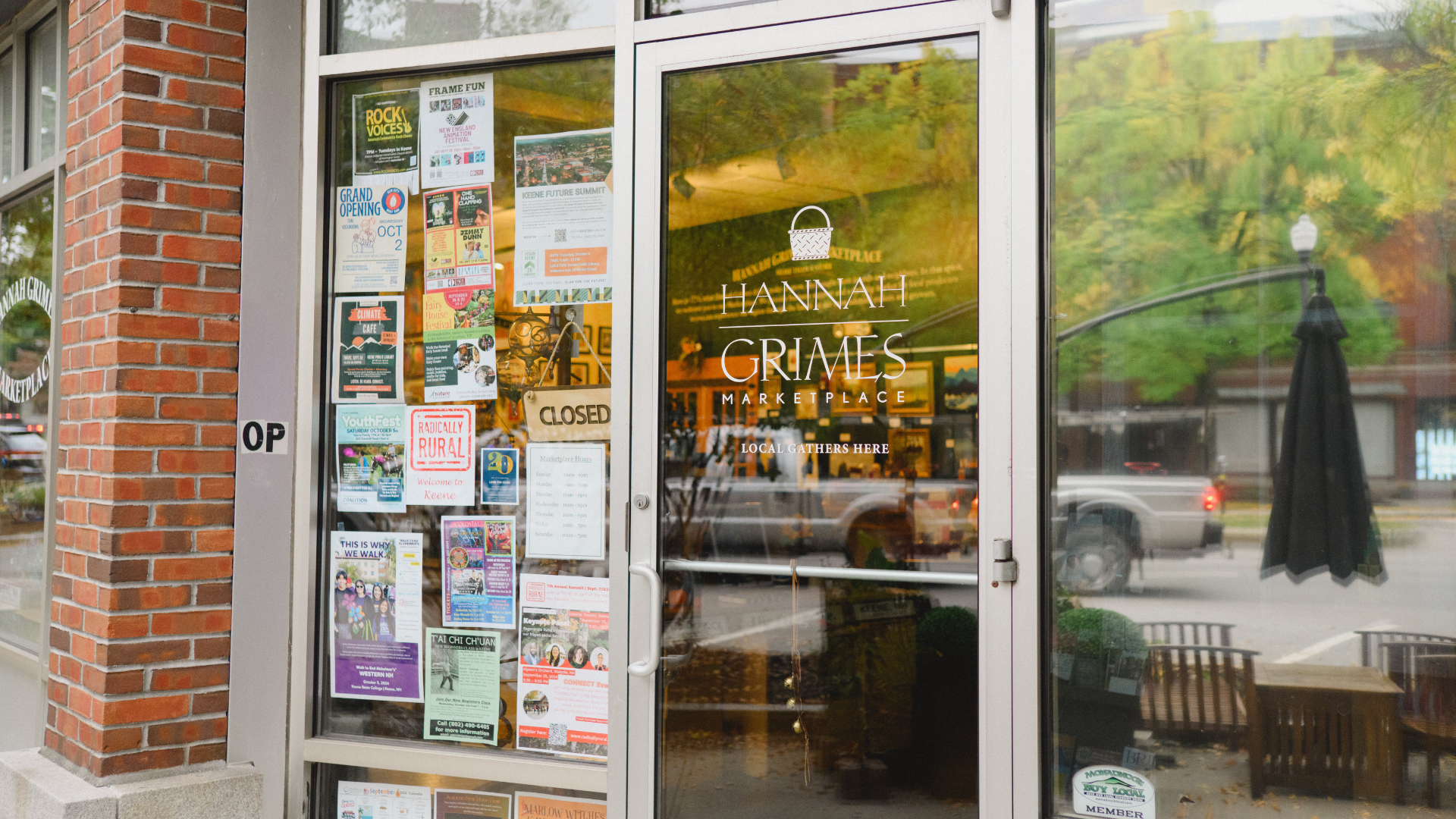 Door to downtown business, Hannah Grimes Marketplace, with posters in the window.