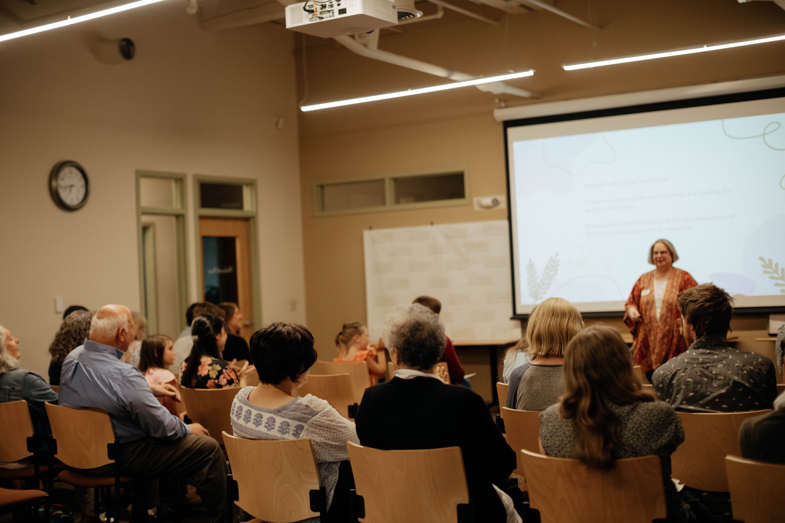 A woman presenting to a crowd